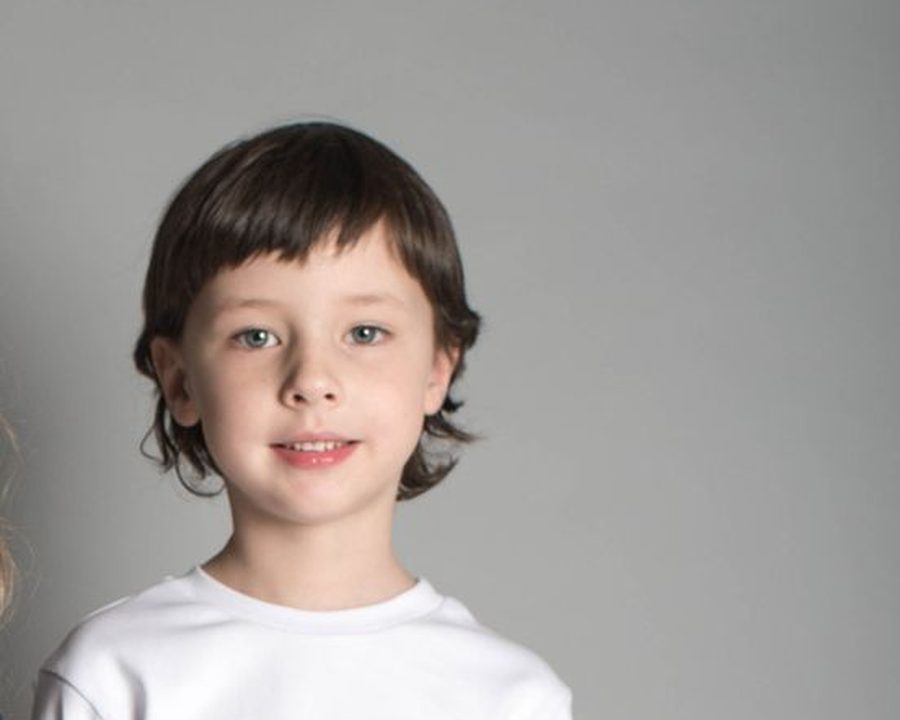 Young boy with a neat child haircut in a studio portrait